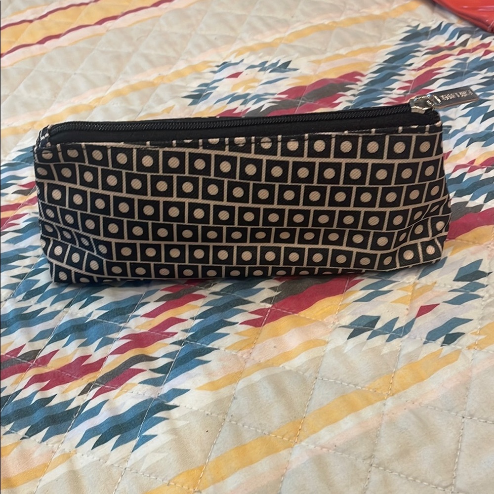 Estée Lauder black and cream makeup bag